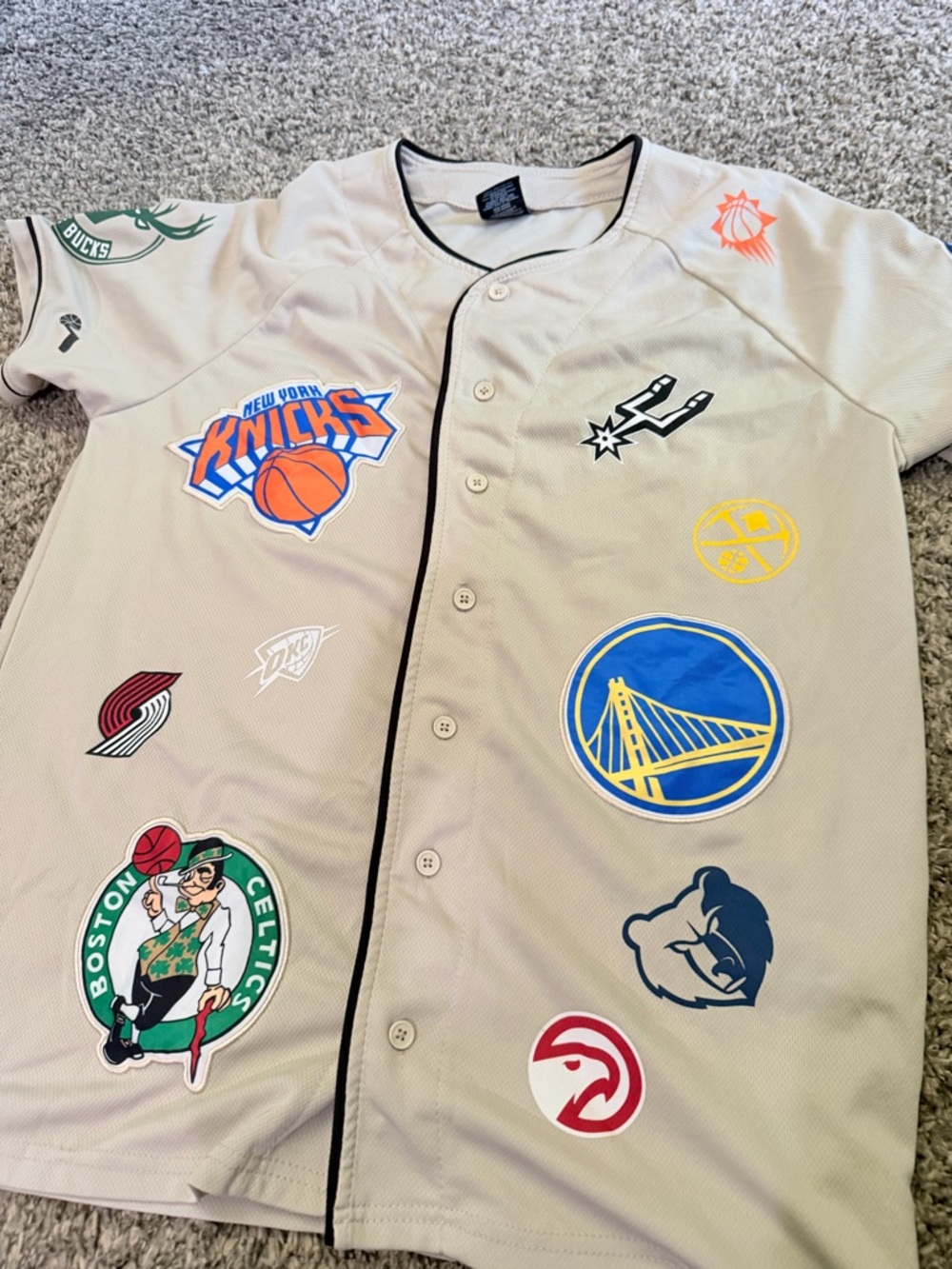 NBA Logo Tag Tee in Beige with Red and Blue Logo